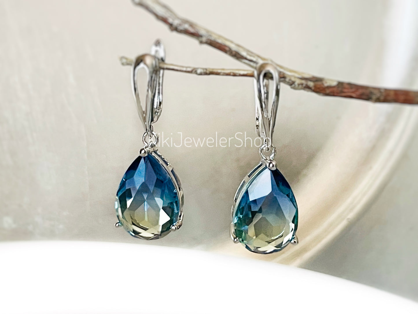 Large bicolor blue sapphire dangles gold